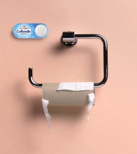 Dash Button neben leerer Toilettenpapierrolle